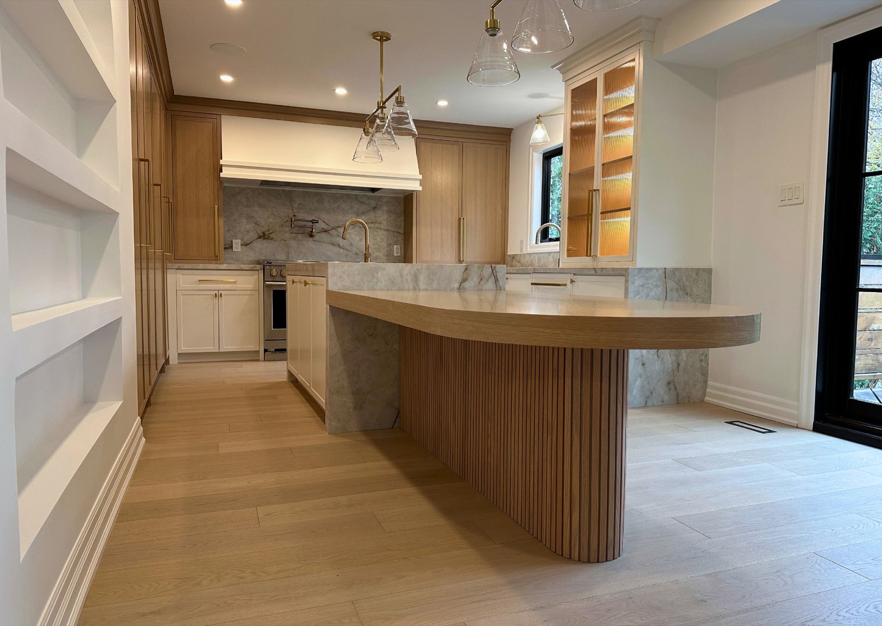 Fluted oak island — custom kitchen, Toronto