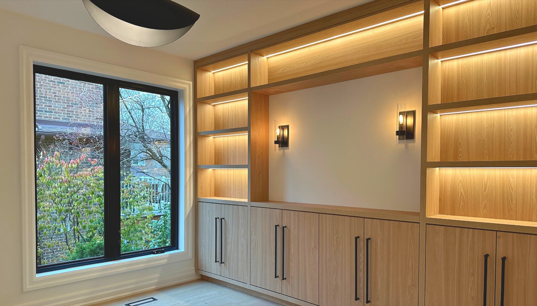 Oak wall unit with integrated lighting by Dezino