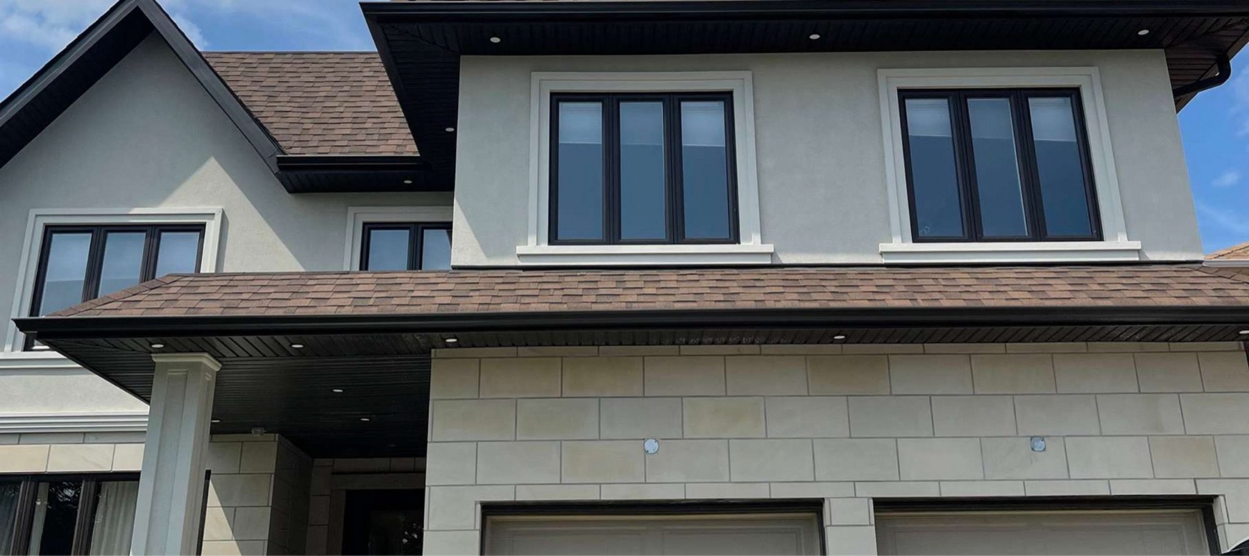 Black-frame vinyl windows on a GTA home by Royal York